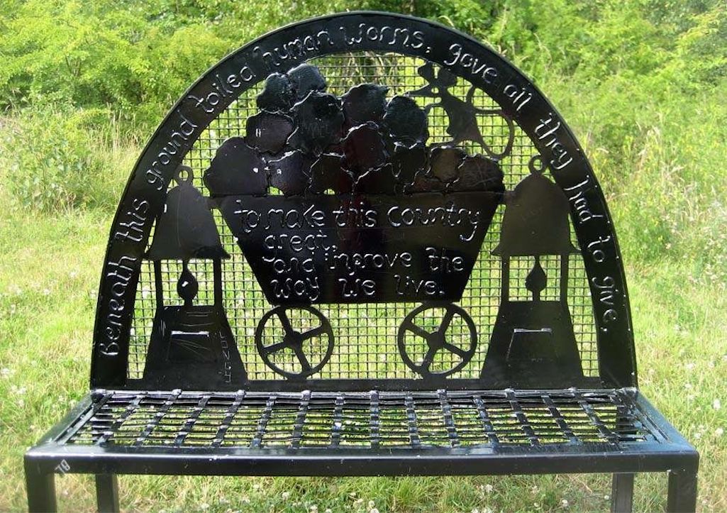 Close up of bench in Sutton Manor Woodland which commemorates Sutton Manor Colliery